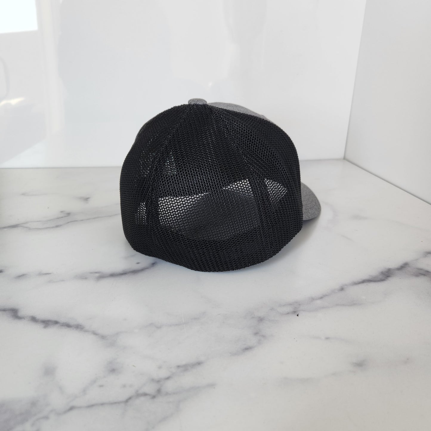 Flex Fit Trucker Hat with Black Blue Line Flag Wooden Patch