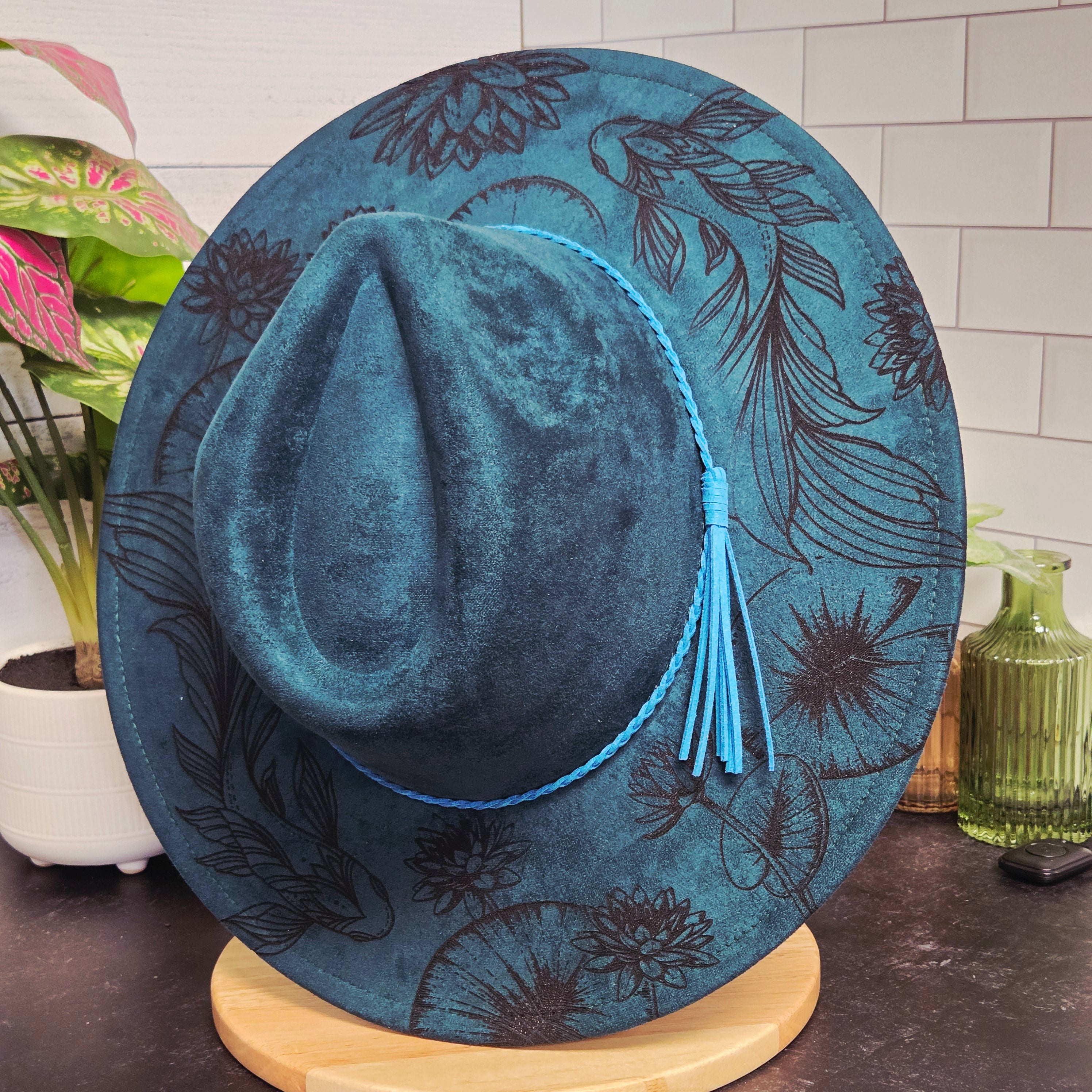 Blue decorative item with floral patterns on a surface