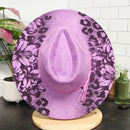 Purple floral-patterned hat on a mannequin head with a white tiled background