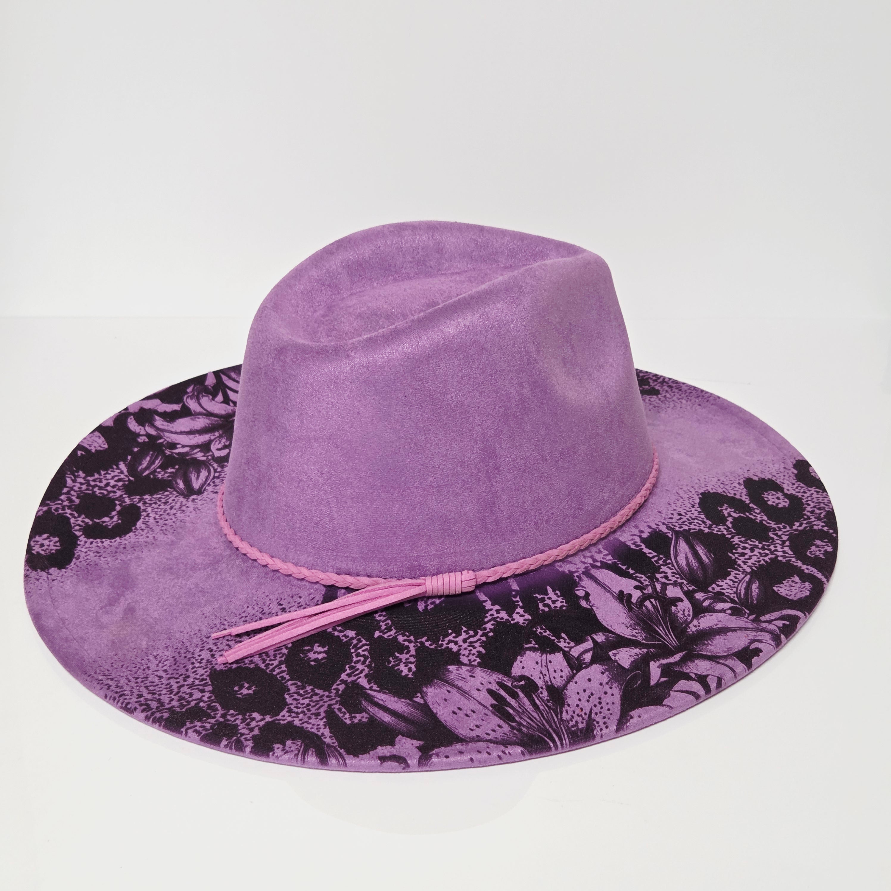 Purple velvet hat with floral pattern on a white background