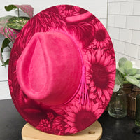 Red floral-patterned plate on a white surface with greenery