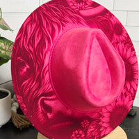 Pink hat with floral pattern on a white background