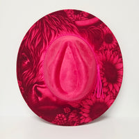Pink hat with floral pattern on a white background