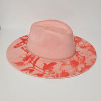 Pink hat with red floral pattern on a white background