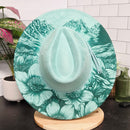 Floral-patterned hat on a table with a tiled floor background