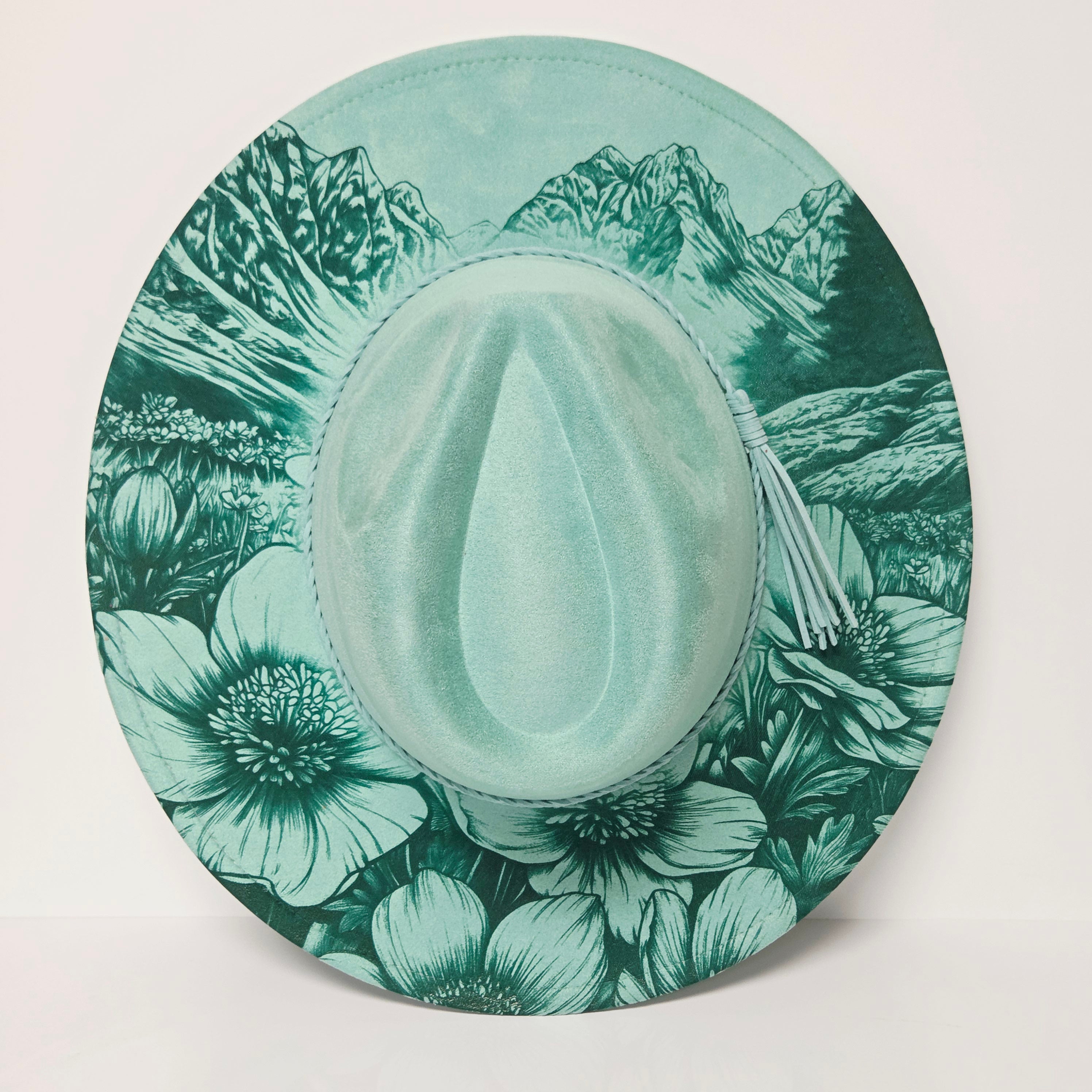 Round green plate with floral pattern on a white background