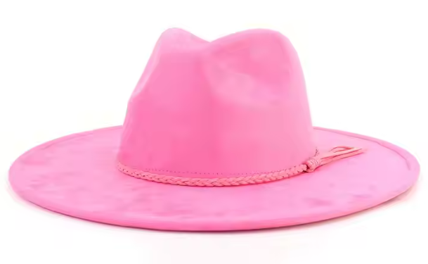 Pink cowboy hat with a braided band on a white background
