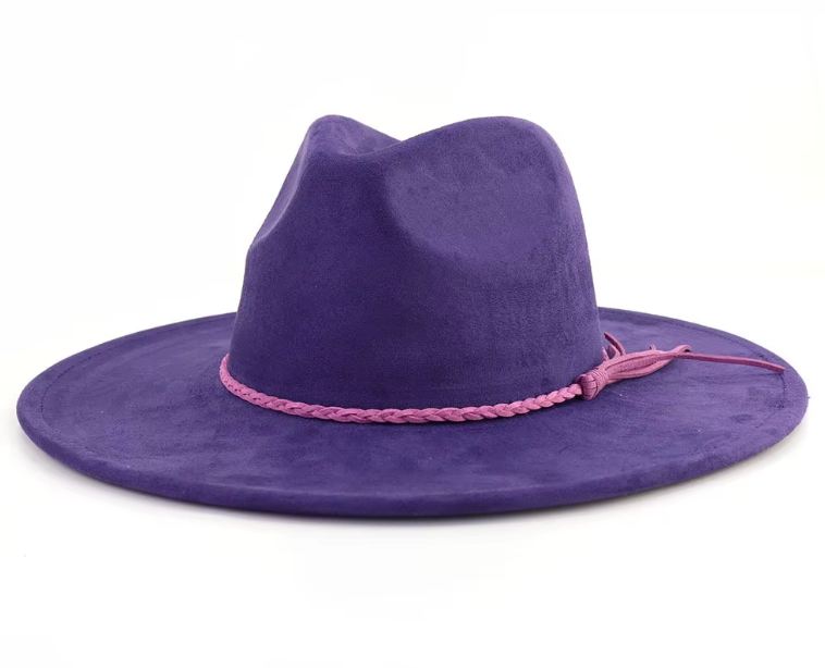 Purple cowboy hat with a pink band on a white background