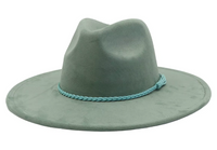 Green hat with a braided band on a white background